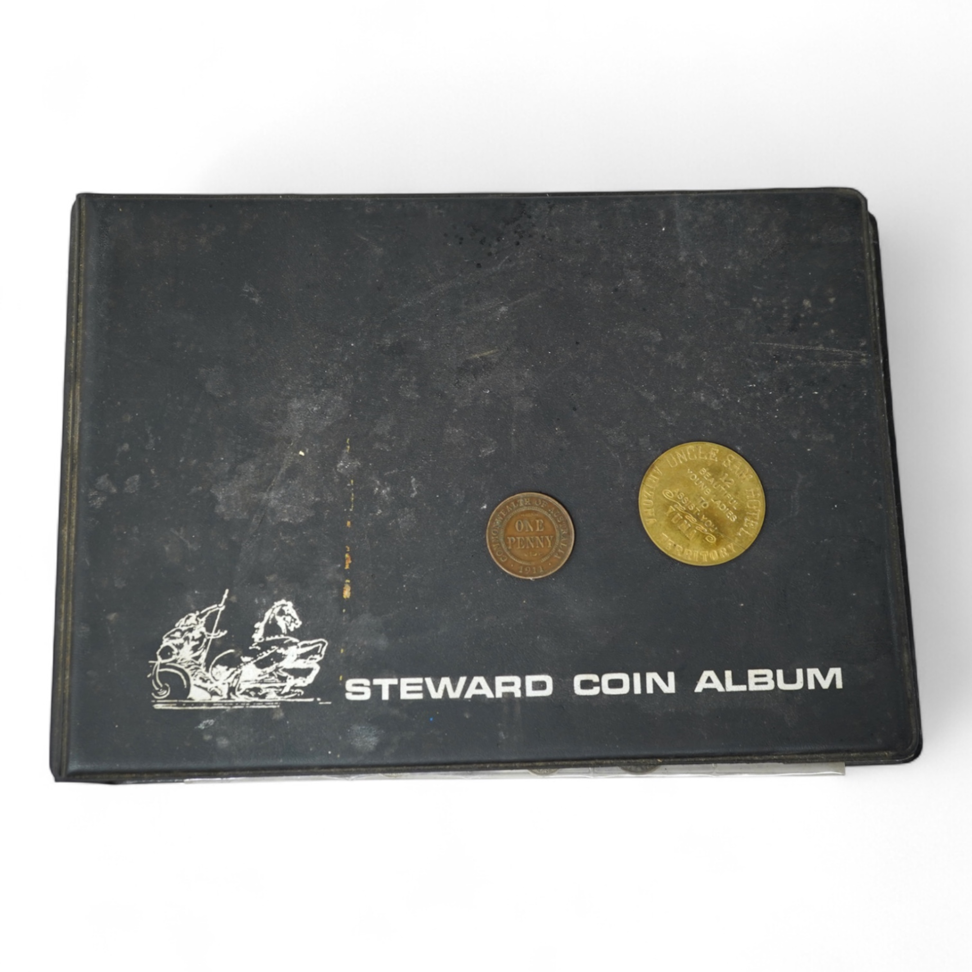 A collection of various coinage in an album, mostly George V to QEII